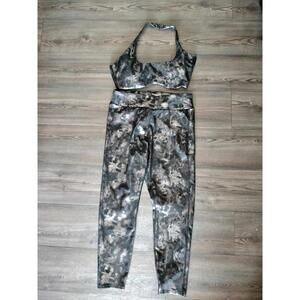 Black and gunmetal oil spill activewear leggings and sports bra set